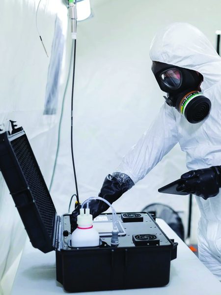 NVAK engineer running a Cleamix vH2O2 decontamination cycle